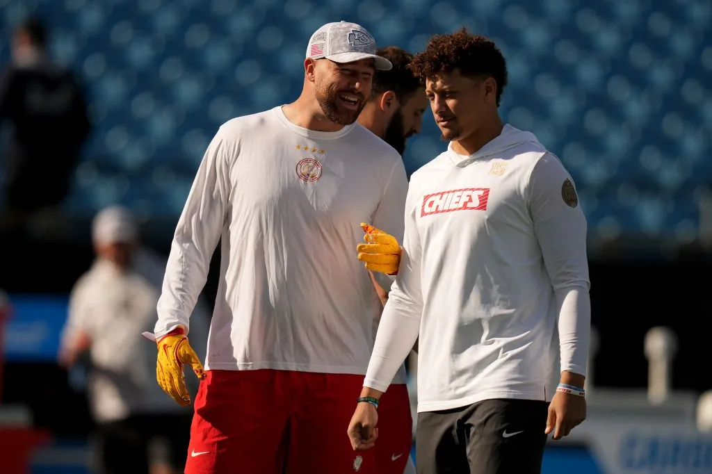 Travis Kelce #87 and Patrick Mahomes #15 of the Kansas City Chiefs warm up at prior to a game against the Carolina Panthers Bank of America Stadium on November 24, 2024 in Charlotte, North Carolina.