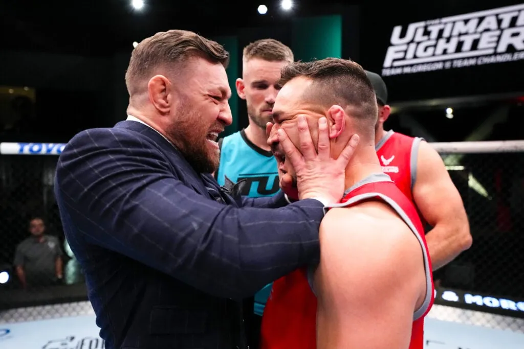 (L-R) Conor McGregor pushes Michael Chandler during filming of The Ultimate Fighter at UFC APEX on March 3, 2023 in Las Vegas, Nevada.