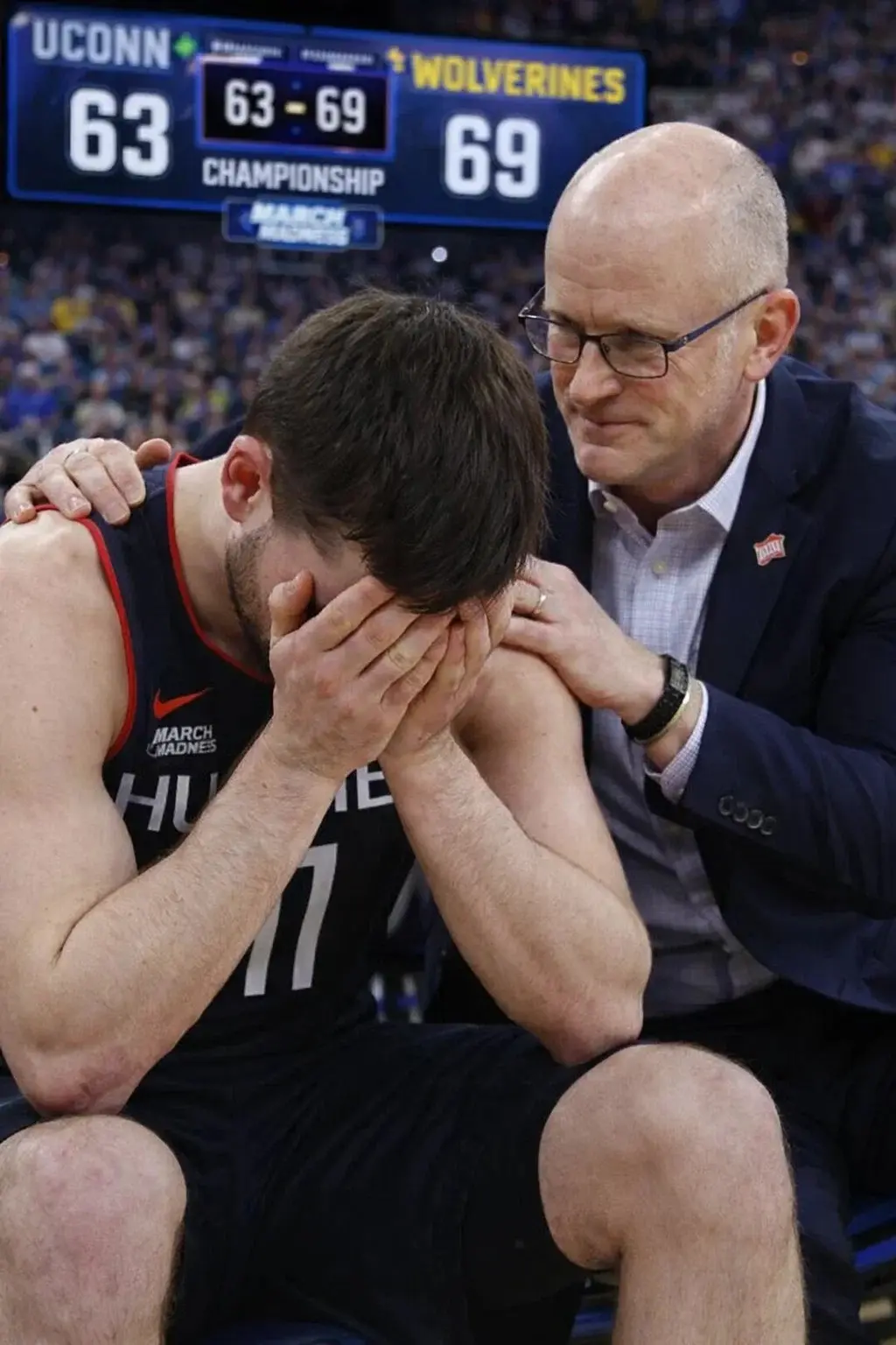 Cover Image for While cheers echoed through the arena after the Wolverines’ dramatic 69–63 victory over UConn, Alex Karaban collapsed onto the hardwood.